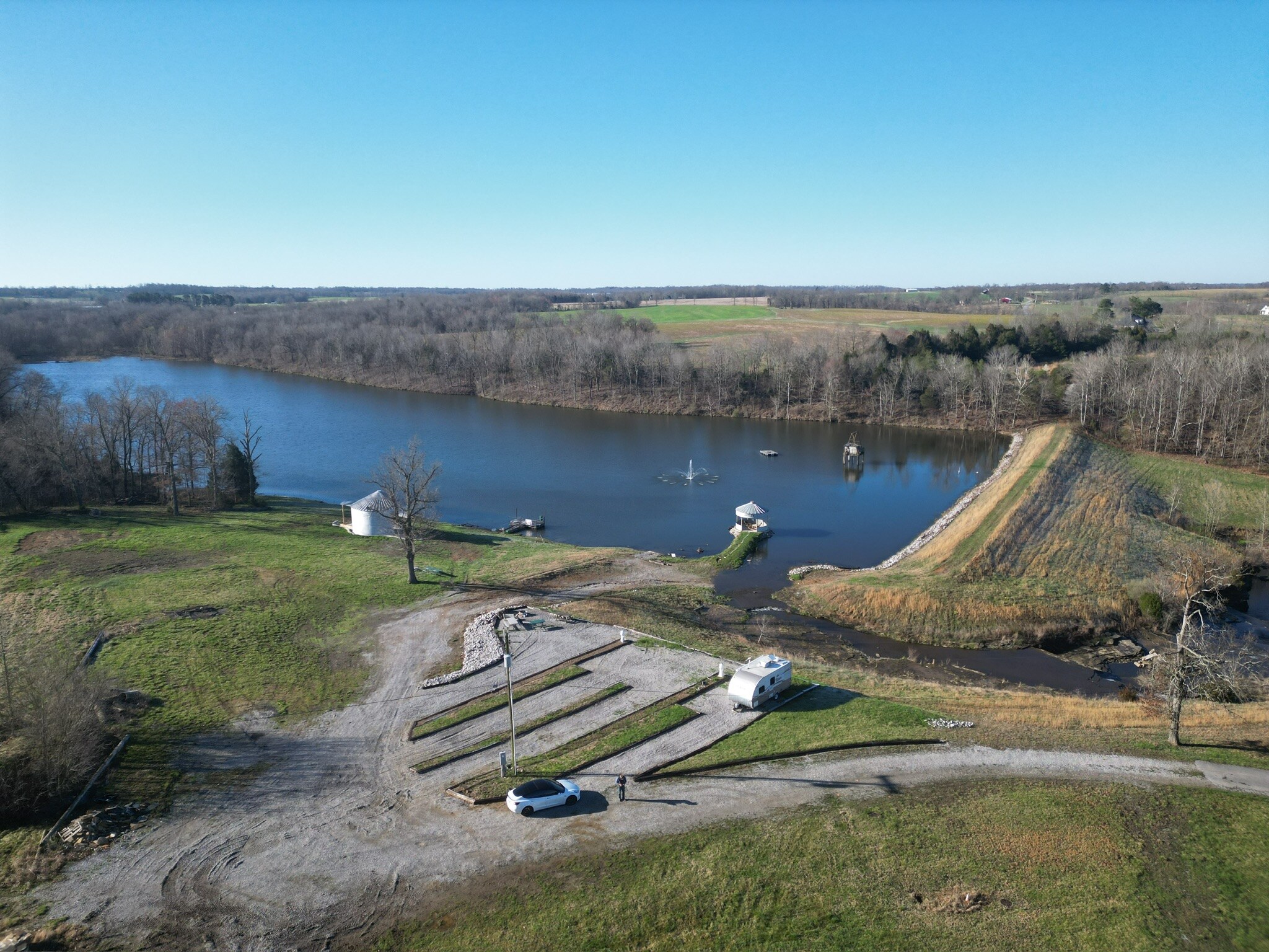 Aerial view of four full-service campsites beside Tuckaway Lake
